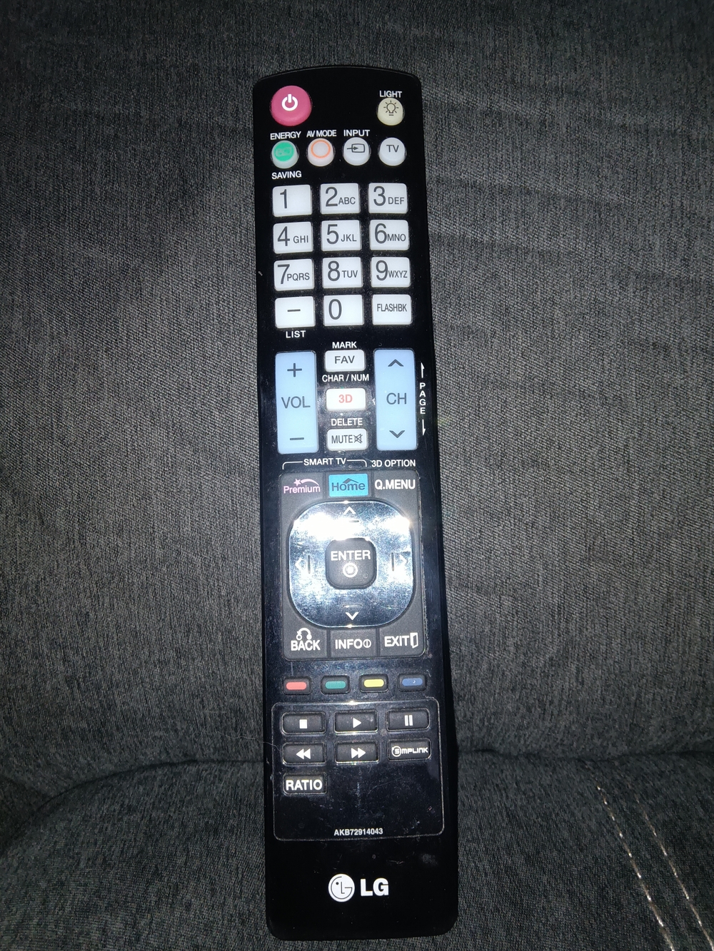 LG Black Remote with White and Light Blue Buttons